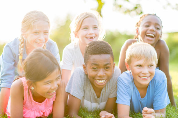istock Kids Laying In The Grass 924899018