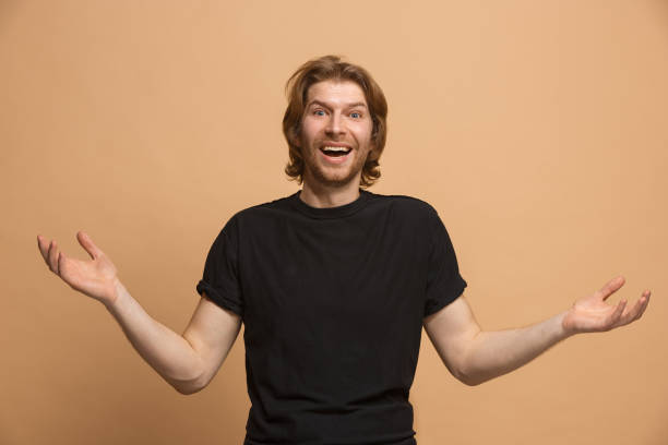 istock The young attractive man looking suprised isolated on pastel 924900622