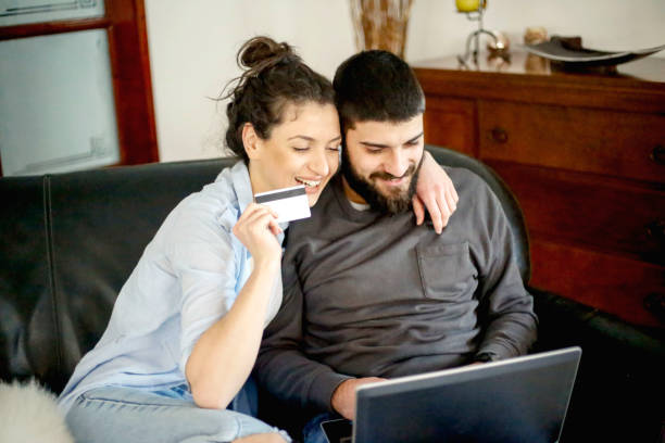 istock Young couple paying online by credit card 924905740