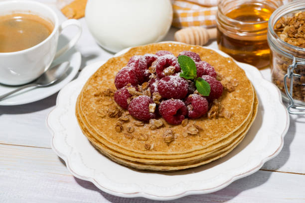 istock traditional pancakes with fresh raspberries for breakfast on wooden table 924907012