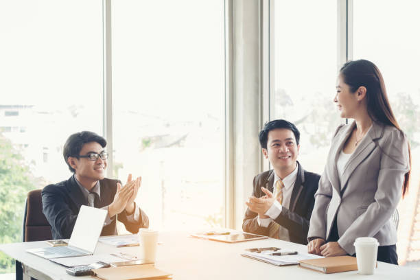 istock Men Applauding Woman At Office 924907082
