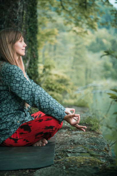 istock Side View Of Young Woman Doing Yoga 924907646