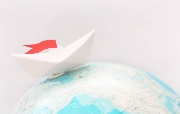 istock Travel concept with paper boat 924911328