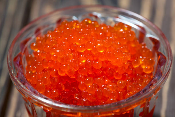 istock traditional red caviar in a jar, closeup 924918500