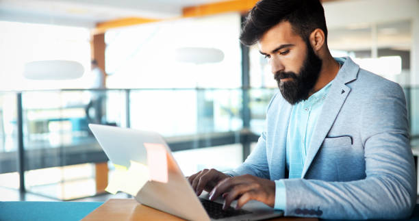 istock Professional businessman working on laptop in office 924919946