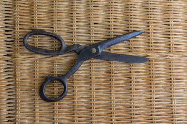 istock old forged black scissors on a matted mat 924920238