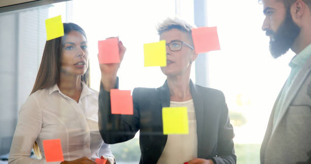 istock Picture of designers sticking notes in office 924922918