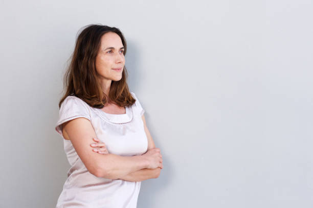 istock attractive older woman staring at copy space 924923378
