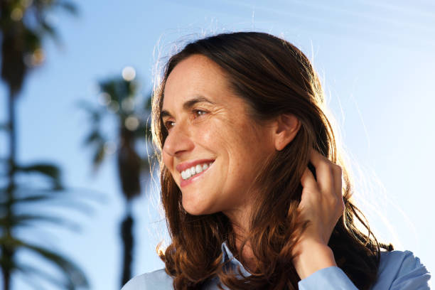 istock Close up happy middle aged woman smiling outside 924923382
