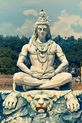 Rishikesh, India - August 29th, 2012: Statue of Lord Shiva sitting in meditation on Ganga Ghat of river Ganges