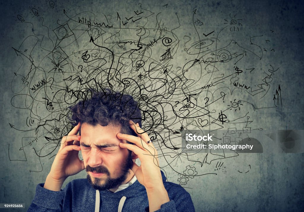 Thoughtful stressed young man with a mess in his head Emotional Stress Stock Photo