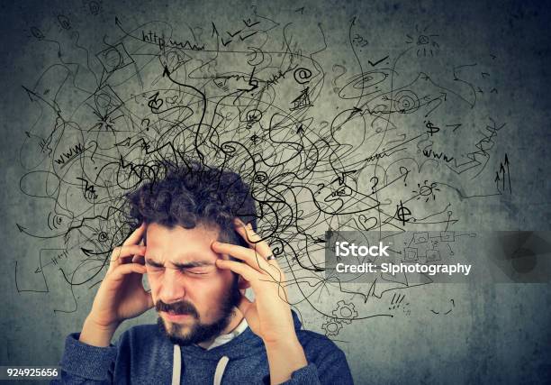 Thoughtful Stressed Young Man With A Mess In His Head Stock Photo - Download Image Now