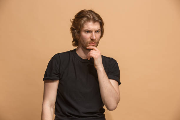 istock Young serious thoughtful businessman. Doubt concept 924926880