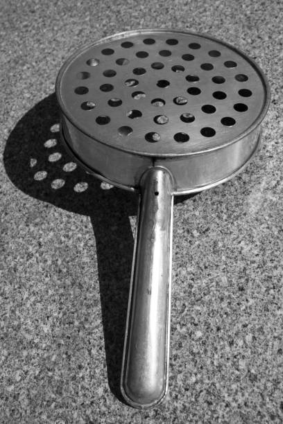 istock Rural kitchen utensil - strainer on the table. 924927186