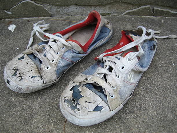 Lovely Old Sneakers i have more images of these same sneakers in my portfolio..please check them out. kids dirty shoes stock pictures, royalty-free photos & images