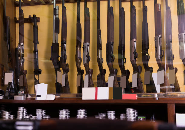 gun shop interior with rifles - airsoft gun imagens e fotografias de stock
