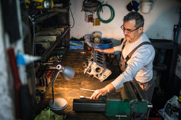 istock Auto mechanic working on a car engine in repair shop 924928038