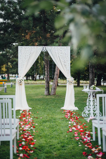 istock Wedding arch for the wedding ceremony, decorated with cloth and flowers 924930482