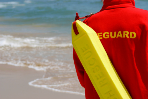 Baywatch Lifeguard With Float At A Beach