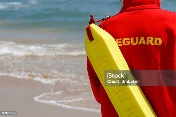 Baywatch Lifeguard With Float At A Beach Stock Photo - Download Image Now - Lifeguard, Beach, Australia