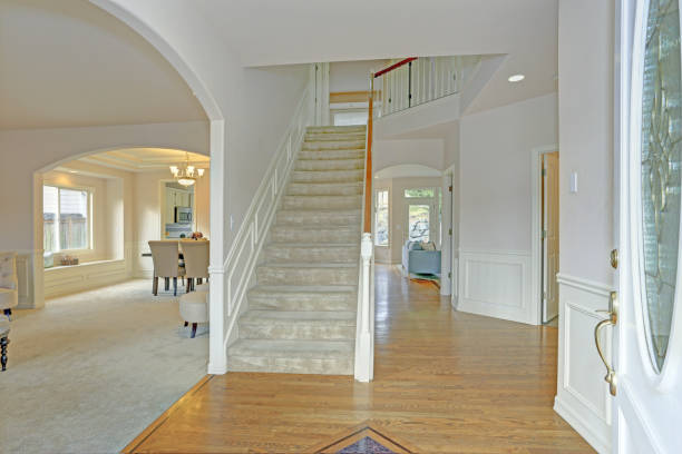 istock Bright foyer with white walls and staircase 924935250