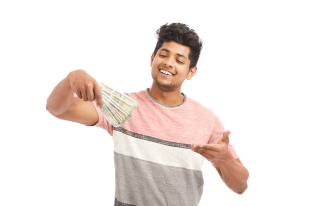 istock Attractive young Indian cheering with Indian rupees 924935544