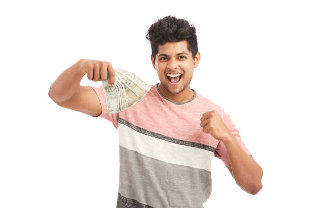 istock Attractive young Indian cheering with Indian rupees 924935548