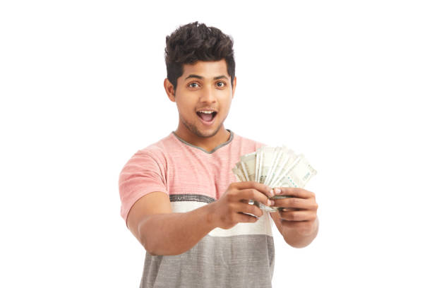 istock Surprised Indian young man with Indian rupees 924935576