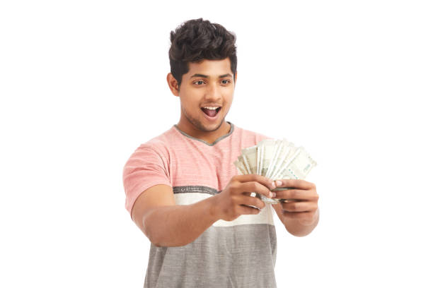 istock Surprised Indian young man with Indian rupees 924935586
