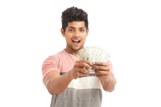 istock Surprised Indian young man with Indian rupees 924935590
