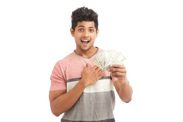 istock Surprised Indian young man with Indian rupees 924935608