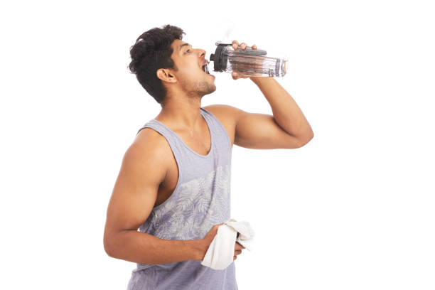 istock Young athlete drinking water in bottle 924935674