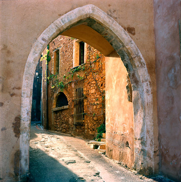 istock Narrow Street with arch 92493696