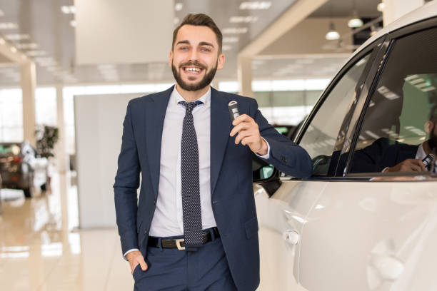 istock Handsome Car Salesman Holding Keys 924938292