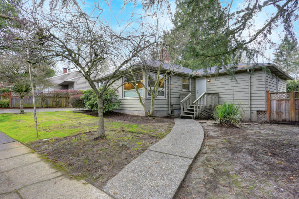 istock One story home with grey exterior paint, back yard 924938548