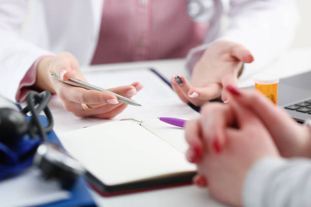 istock Female doctor hand hold silver pen 924939126