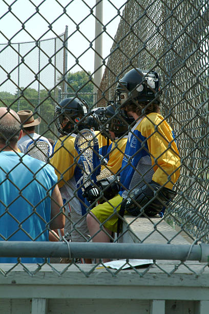 Lacrosse players on the bench stock photo