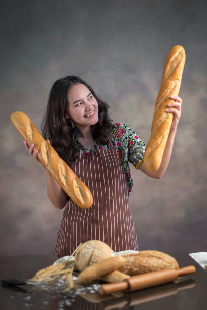 Young hipster stylish woman with baguette on the beautiful background