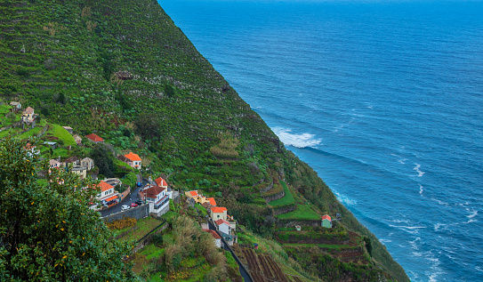 Porto Moniz - colorful buildings on a cliff in north Madeira - Portugal