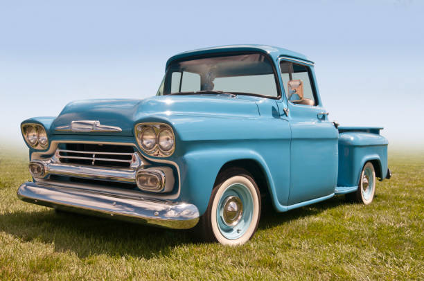 Old Blue Farm Truck A Classic American Pickup Truck Sitting in a Field. collectors car photos stock pictures, royalty-free photos & images