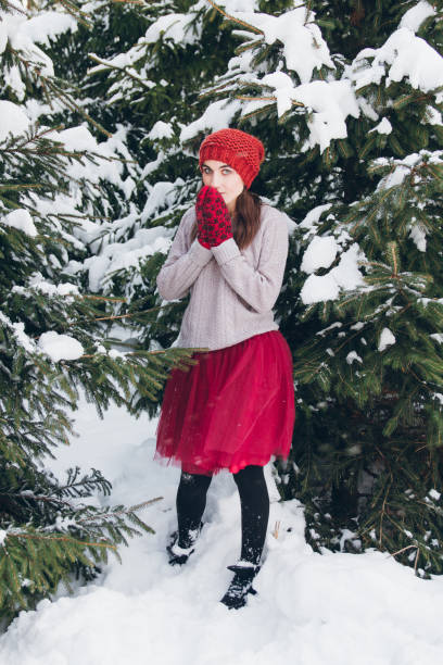 istock Woman having fun in winter forest 924949210