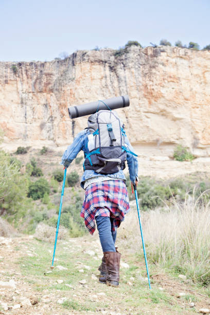 istock Man Traveler with backpack mountaineering 924951360