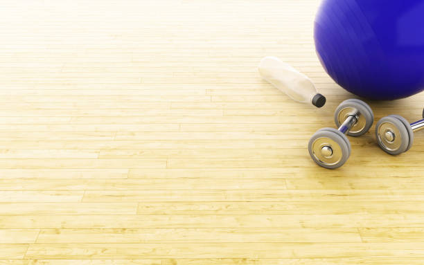 istock 3d Fitness ball and weights. 924954860
