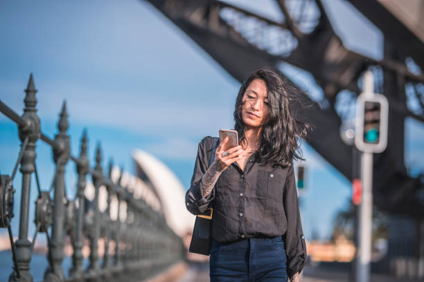 istock Woman using phone in Sydney 924955342