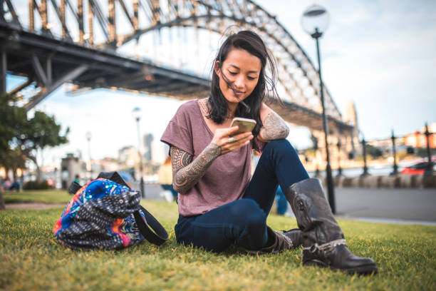 istock Woman using mobile phone in Sydney 924955460