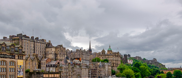 Panoramic view on the traditional old gothic buildings in the downtown of Edinburgh, the capital city of Scotland. In the background you can see the Edinburgh Castle, perched on the Castle Rock.