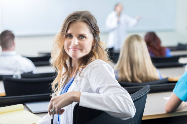 istock Confident female doctor attends continuing education seminar 924958486