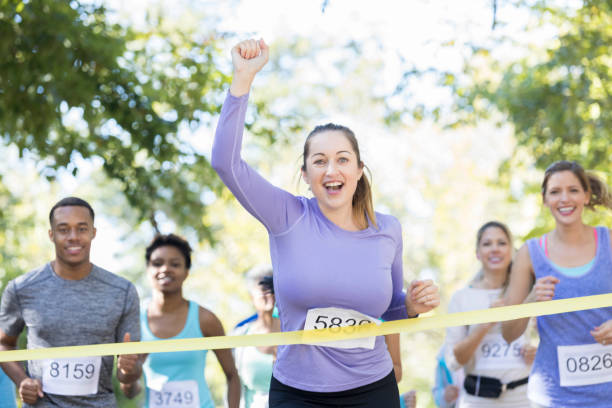 istock Confident female runner wins race 924958726