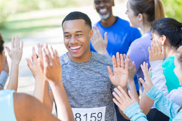 istock Excited young man finishes charity race 924958728