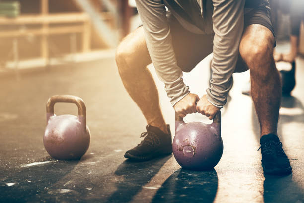 istock Man lifting a dumbbell during a gym workout session 924962670